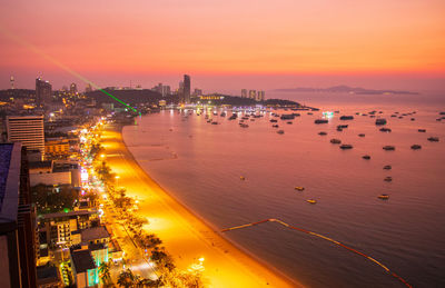 High angle view of city at sunset