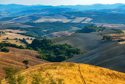 Scenic view of landscape and mountains against sky