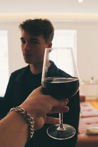 Young man drinking beer glass