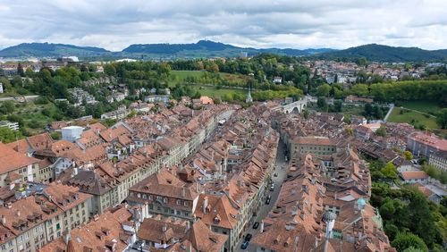 High angle view of town against cloudy sky