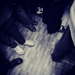 Low section of men standing on floor