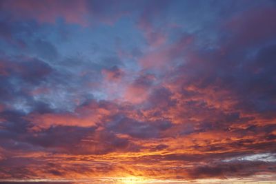 Low angle view of dramatic sky during sunset