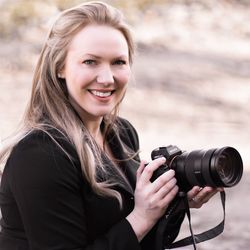 Portrait of smiling woman photographing