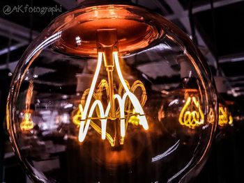 Close-up of illuminated light bulb