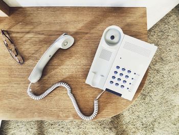 High angle view of telephone receiver on table