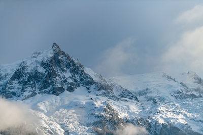 Snow covered mountain against sky