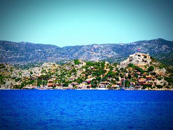 Scenic view of calm sea against clear blue sky