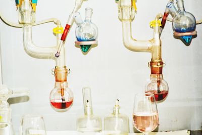 Wine bottles hanging in glass