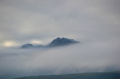 Scenic view of mountains against sky during winter