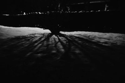 Close-up of snow on water at night