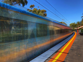 Train on railroad station platform against sky