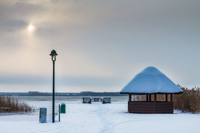 Scenic view of snow covered landscape against sky