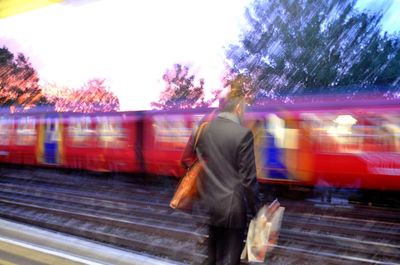 Blurred motion of train at railroad station