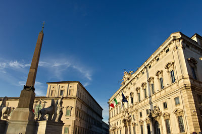 Low angle view of building against blue sky