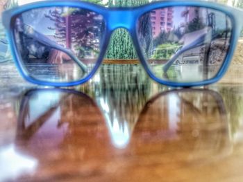 Reflection of sunglasses on glass