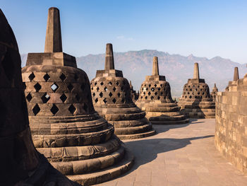 Stupas of temple against sky