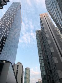 Low angle view of modern buildings against sky