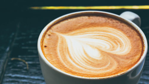 Close-up of coffee cup on table