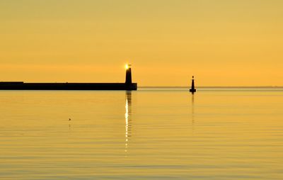 Scenic view of sea at sunset