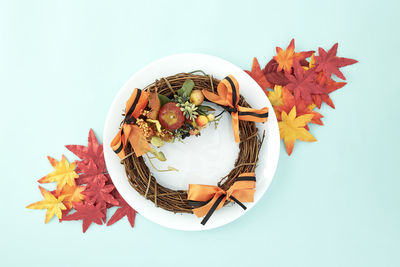 High angle view of maple leaves on white table