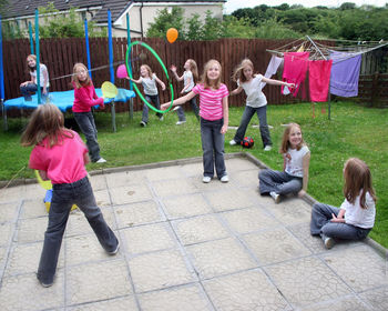 Rear view of people walking outdoors