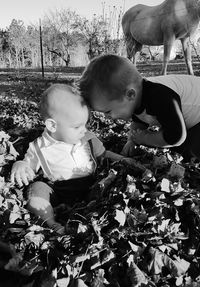 High angle view of boy standing amidst plants