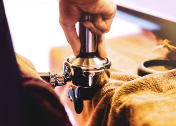 Close-up of man working in machine