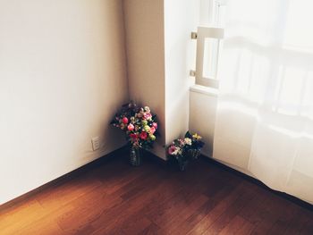 Flower vase on table at home