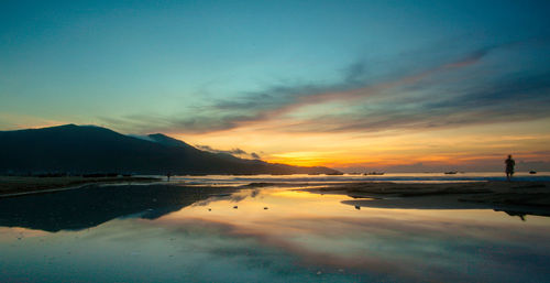 Scenic view of sea against sky during sunset