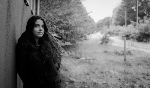 Portrait of beautiful young woman looking away