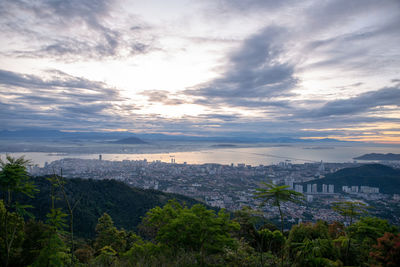 High angle view of buildings and trees against sky