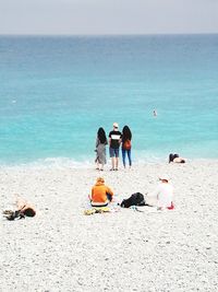 Rear view of people on beach