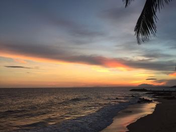 Scenic view of sea against sky at sunset