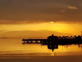 Scenic view of lake against sky during sunset