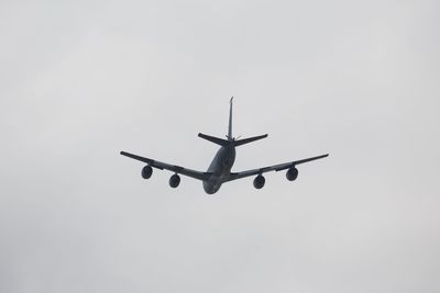 Low angle view of airplane flying in sky