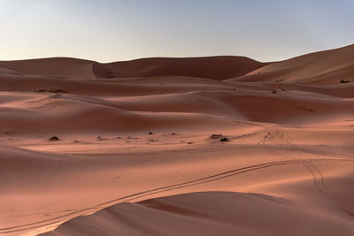 Scenic view of desert against clear sky