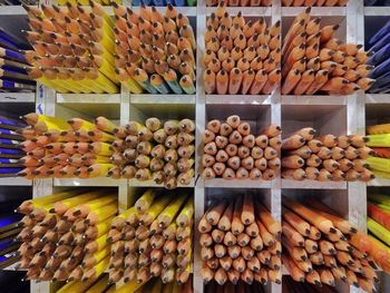 Full frame shot of pencils in shelves at store for sale