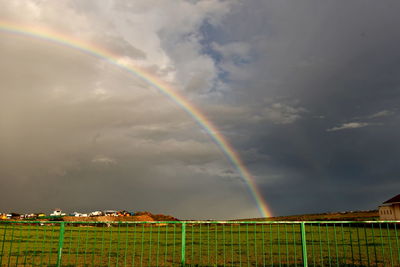 Low angle view of rainbow against sky