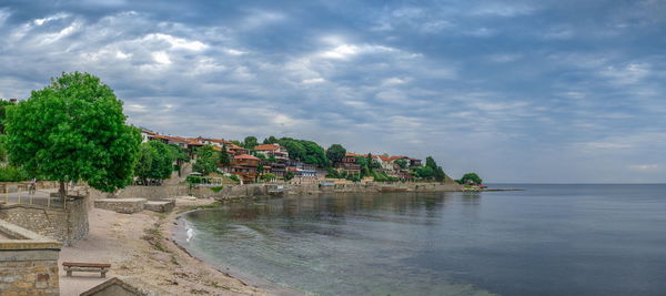 Scenic view of sea against cloudy sky