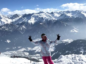 Full length of person on snowcapped mountain against sky