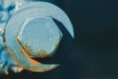 Close-up of rusty metal against black background