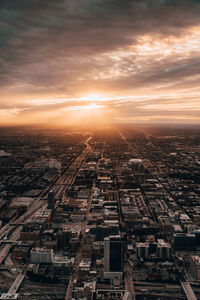 High angle view of city against sky during sunset