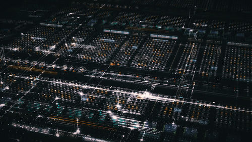 High angle view of illuminated buildings in city at night