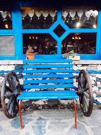 Bicycle parked on snow covered bench