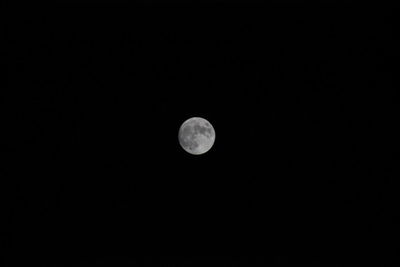 Low angle view of moon against sky at night