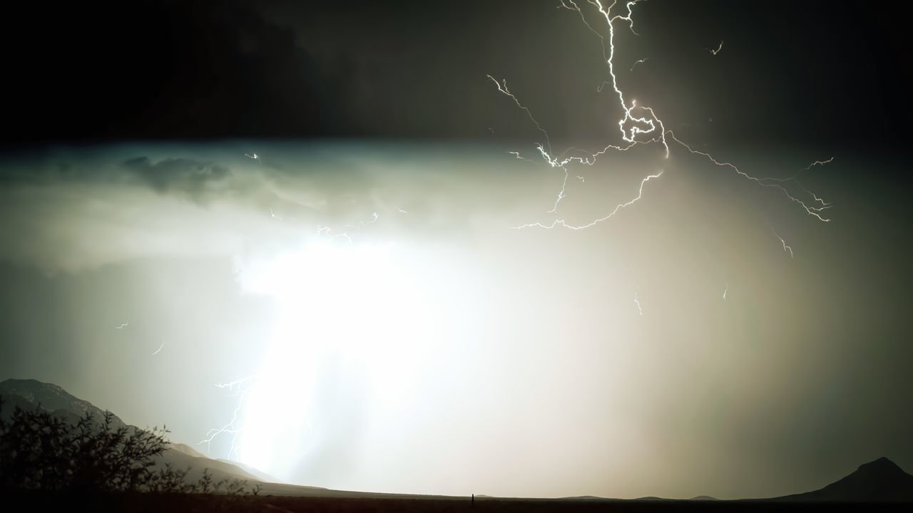 lightning, storm, thunderstorm, power in nature, cloud, thunder, beauty in nature, sky, night, environment, storm cloud, nature, warning sign, dramatic sky, scenics - nature, darkness, no people, sign, landscape, forked lightning, mountain, outdoors, atmospheric mood, rain, communication, extreme weather, wet, dark, silhouette, awe, light, light - natural phenomenon, overcast, electricity