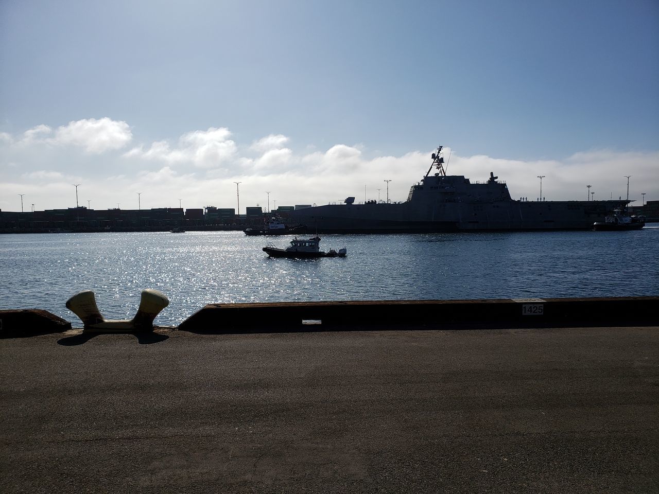 SCENIC VIEW OF HARBOR AGAINST SKY