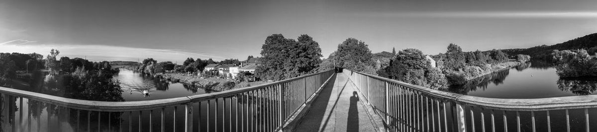 Panoramic shot of footbridge against sky