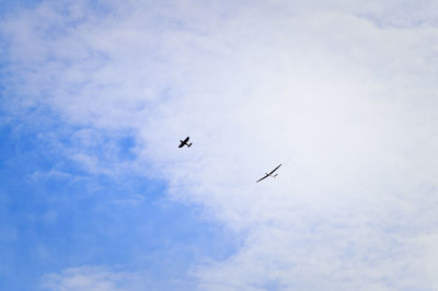 Low angle view of airplane against the sky
