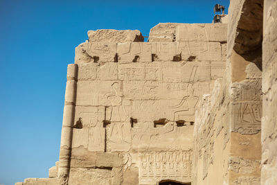 Different hieroglyphs on the walls and columns in the karnak temple.